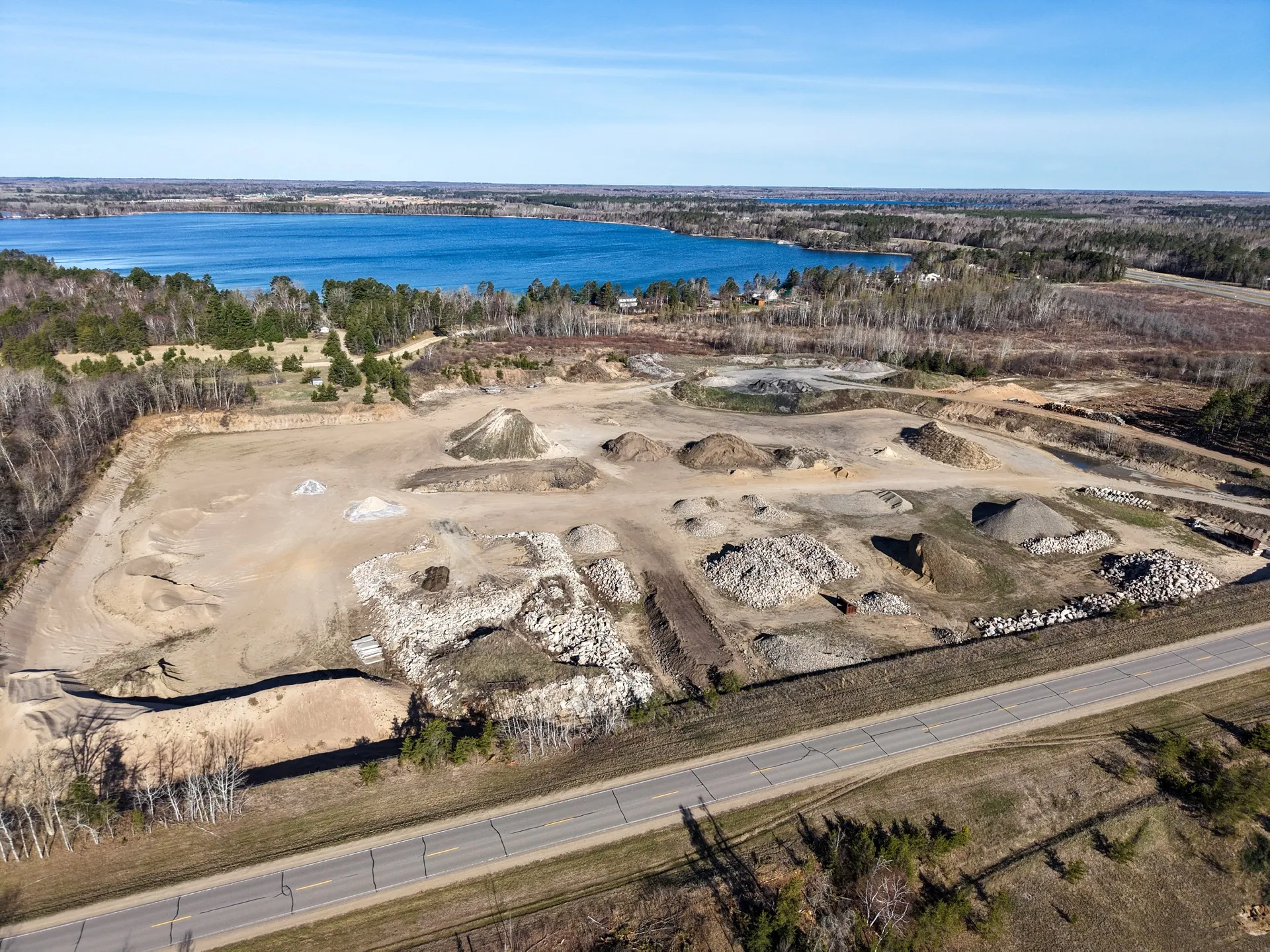 Aerial site documentation of a Storlie Construction gravel pit with Midge Lake visible in the background near Cass Lake, Minnesota.